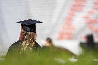 photo of anonymous student in cap and gown at UGA