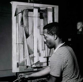 Norman Lewis working on Composition I, 1945. Courtesy Willard Gallery Archives