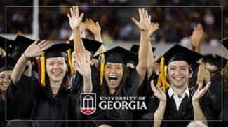 cheering UGA graduates in cap and gown