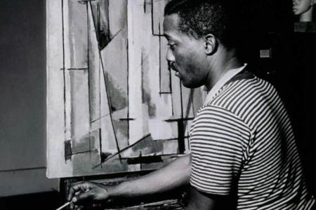 Norman Lewis working on Composition I, 1945. Courtesy Willard Gallery Archives