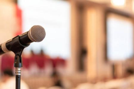 Image of a microphone in a lecture hall