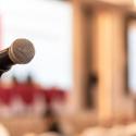 Photo of a microphone in a lecture hall